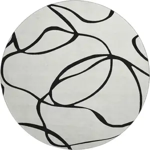 Photo of 8' White And Black Abstract Washable Round Rug With UV Protection