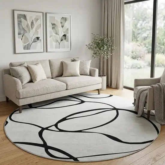 8' White And Black Abstract Washable Round Rug With UV Protection Photo 1