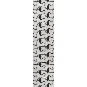 Photo of 8' White And Black Animal Print Indoor Outdoor Runner Rug