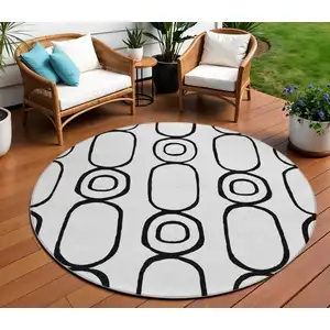 Photo of 8' White And Black Round Geometric Washable Indoor Outdoor Area Rug