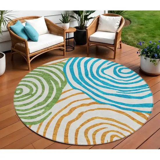 8' White Orange And Teal Blue Round Abstract Washable Indoor Outdoor Area Rug Photo 1