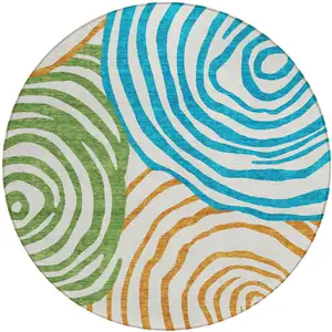 Photo of 8' White Orange And Teal Blue Round Abstract Washable Indoor Outdoor Area Rug