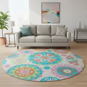 Photo of 8' White Orange And Teal Medallion Washable Round Rug With UV Protection