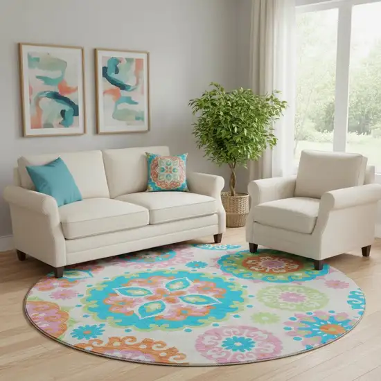 8' White Orange And Teal Medallion Washable Round Rug With UV Protection Photo 1