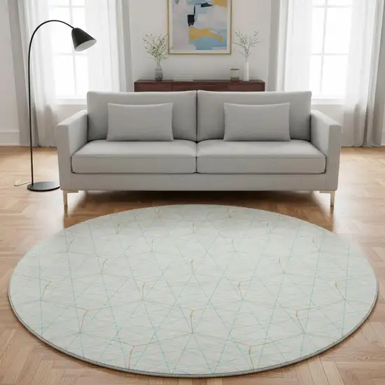 8' White Teal And Orange Geometric Washable Round Rug With UV Protection Photo 2