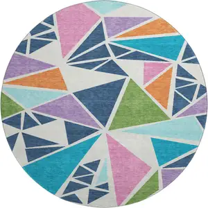 Photo of 8' White Teal Pink And Orange Geometric Washable Round Rug With UV Protection