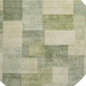 Photo of 8' X 8' Artichoke Green And Beige Geometric Washable Round Rug With UV Protection