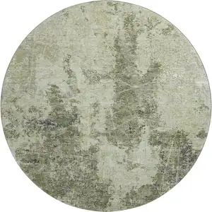 Photo of 8' X 8' Artichoke Green Charcoal And Ivory Abstract Washable Round Rug With UV Protection