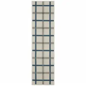 Photo of 2' X 7' Beige Geometric Stain Resistant Indoor Outdoor Area Rug
