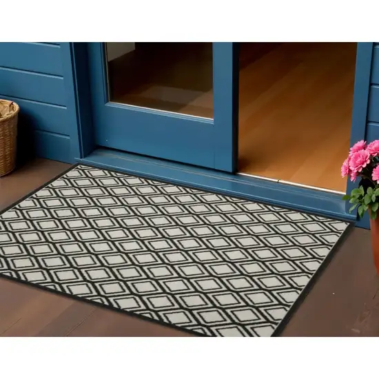 Beige and Black Geometric Stain Resistant Indoor Outdoor Area Rug Photo 1