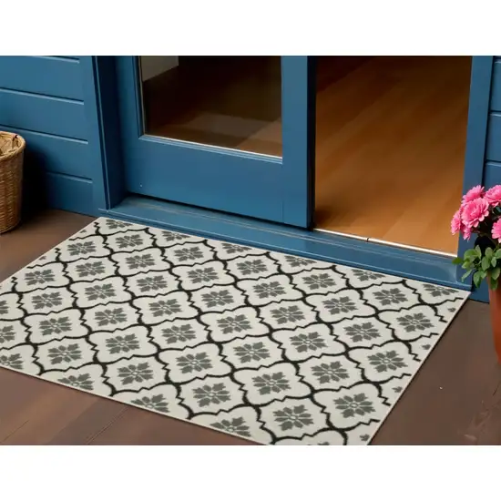 Beige and Black Geometric Stain Resistant Indoor Outdoor Area Rug Photo 1