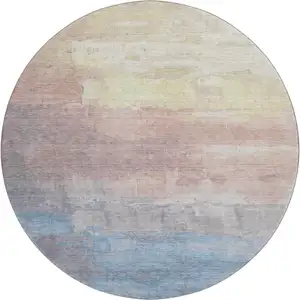 Photo of 8' X 8' Beige Salmon And Blue Abstract Washable Round Rug With UV Protection