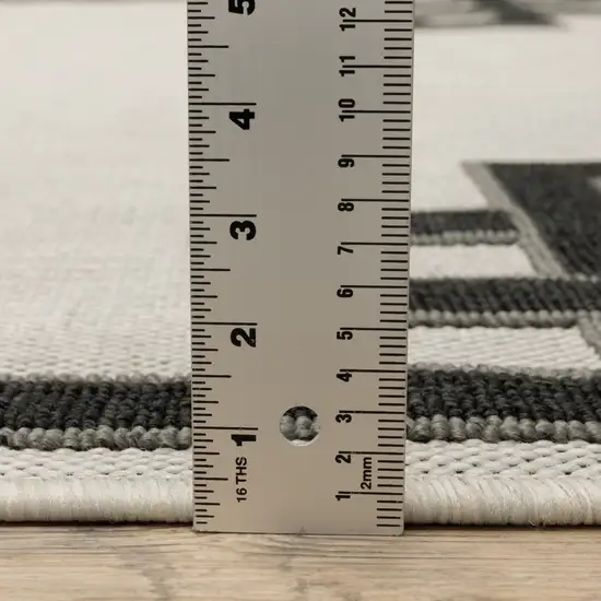 2' X 7' Beige Stain Resistant Indoor Outdoor Area Rug Photo 9