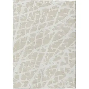 Photo of 3' X 5' Beige and Ivory Abstract Washable Non Skid Indoor Outdoor Area Rug