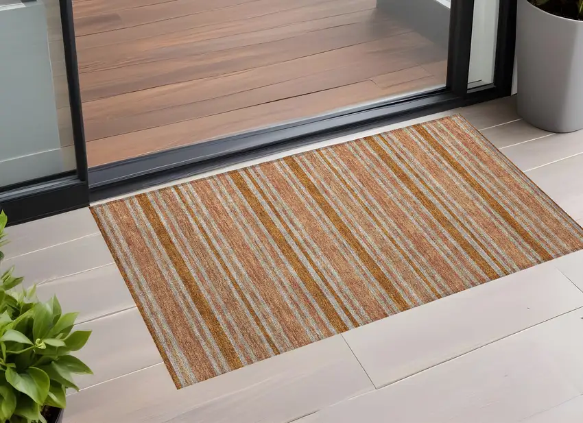 3' X 5' Beige and Orange Striped Washable Non Skid Indoor Outdoor Area Rug Photo 1