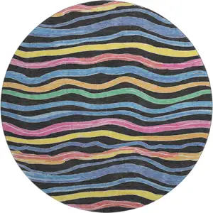 Photo of 8' X 8' Black Yellow Blue And Pink Striped Washable Round Rug With UV Protection