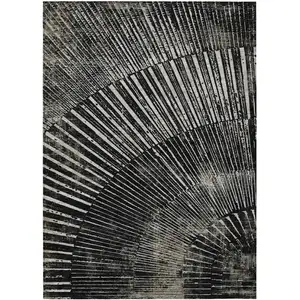 Photo of 3' X 5' Black and Ivory Abstract Washable Non Skid Indoor Outdoor Area Rug