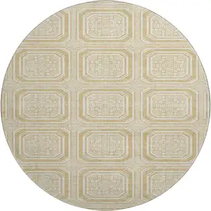 Photo of 8' X 8' Gold And Ivory Geometric Washable Round Rug With UV Protection