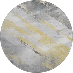 Photo of 8' X 8' Gold Gray And Ivory Striped Washable Round Rug With UV Protection