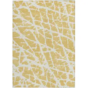 Photo of 3' X 5' Gold and White Abstract Washable Non Skid Indoor Outdoor Area Rug