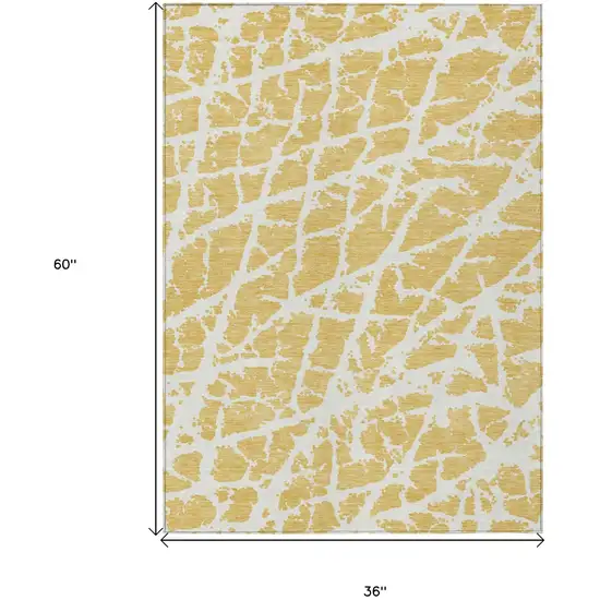 3' X 5' Gold and White Abstract Washable Non Skid Indoor Outdoor Area Rug Photo 3
