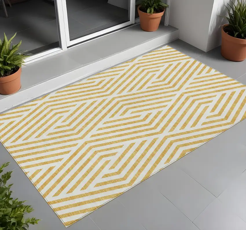 3' X 4' Gold and White Geometric Washable Non Skid Indoor Outdoor Area Rug Photo 1