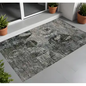 Photo of 3' X 5' Gray Dark Green and Black Floral Washable Non Skid Indoor Outdoor Area Rug