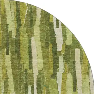 Photo of 8' X 8' Green And Ivory Striped Washable Round Rug With UV Protection