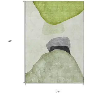 Photo of 3' X 5' Green Black and Gray Abstract Washable Non Skid Indoor Outdoor Area Rug