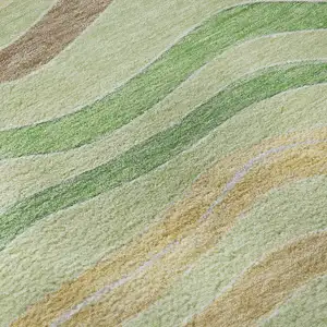 Photo of 8' X 8' Green Wheat And Ivory Striped Washable Round Rug With UV Protection