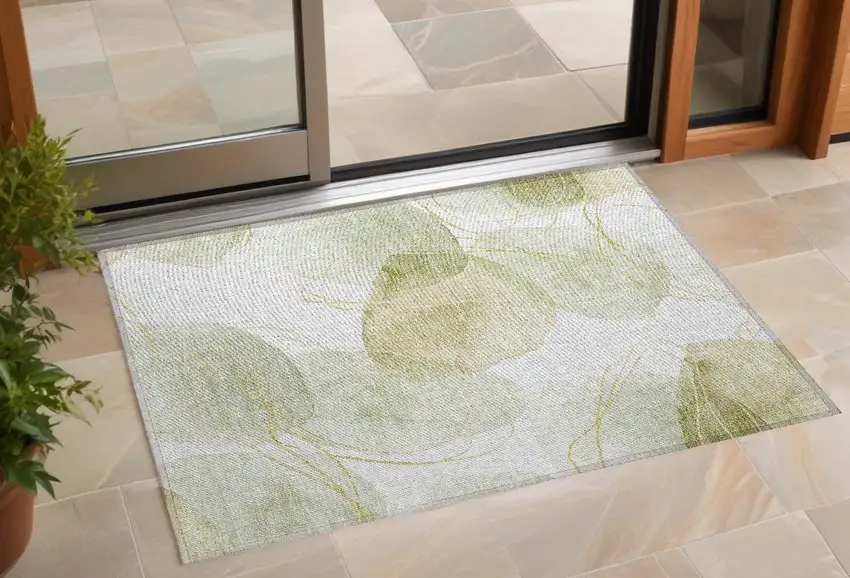 Green and Ivory Abstract Washable Non Skid Indoor Outdoor Area Rug Photo 1