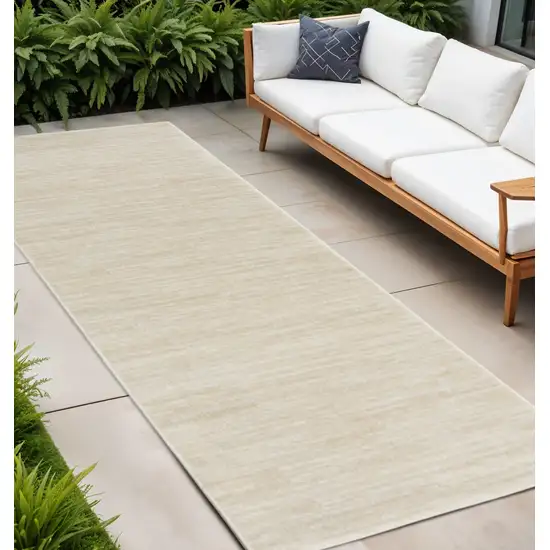 8' Beige And Ivory Indoor Outdoor Runner Rug Photo 1