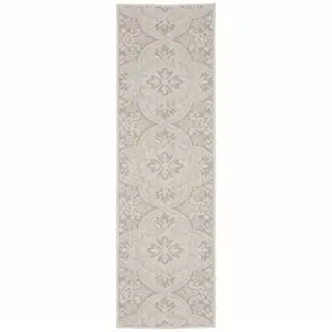 Photo of 2' X 7' Ivory Floral Stain Resistant Indoor Outdoor Area Rug