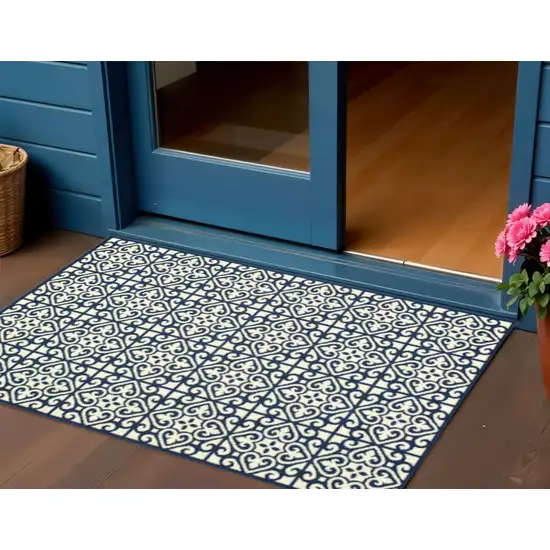 Ivory and Blue Geometric Stain Resistant Indoor Outdoor Area Rug Photo 1