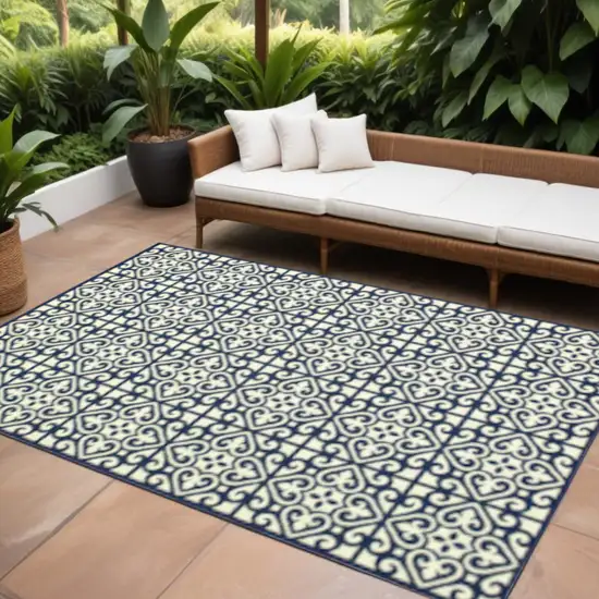 Ivory and Blue Geometric Stain Resistant Indoor Outdoor Area Rug Photo 1