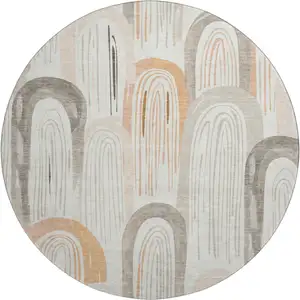 Photo of 8' X 8' Ivory Peach And Taupe Geometric Washable Round Rug With UV Protection