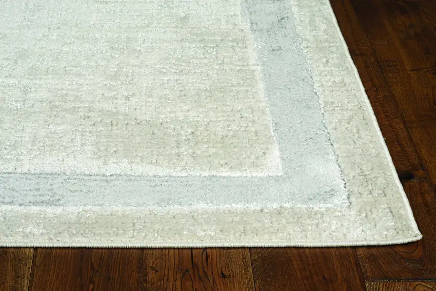 8'X11' Ivory Silver Machine Woven Bordered Indoor Area Rug Photo 1