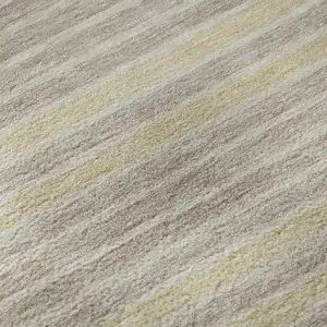 Photo of 8' X 8' Ivory Tan And Taupe Striped Washable Round Rug With UV Protection