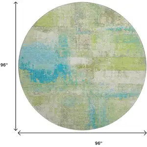 Photo of 8' X 8' Lime Green Teal And Ivory Abstract Washable Round Rug With UV Protection