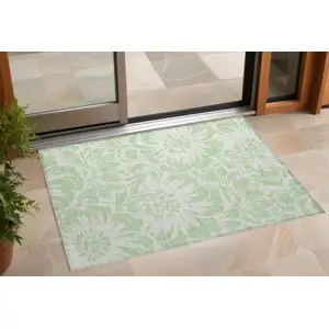 Photo of 3' X 5' Mint Green and Ivory Floral Washable Non Skid Indoor Outdoor Area Rug
