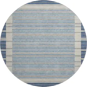 Photo of 8' X 8' Navy Blue Ivory And Gray Striped Washable Round Rug With UV Protection