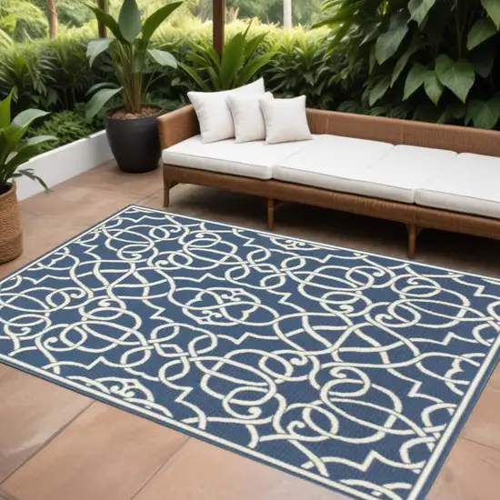 Blue and Ivory Geometric Stain Resistant Indoor Outdoor Area Rug Photo 1