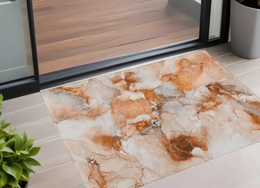 3' X 4' Orange and Ivory Abstract Washable Non Skid Indoor Outdoor Area Rug Photo 1