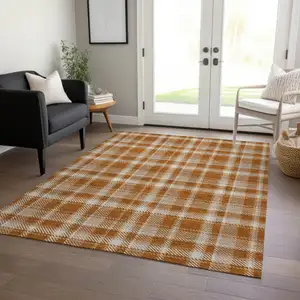 Photo of 3' X 5' Orange and Ivory Plaid Washable Non Skid Indoor Outdoor Area Rug