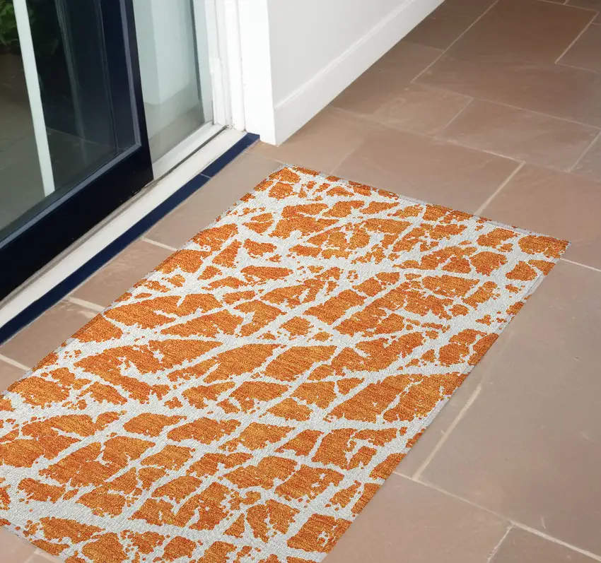 3' X 4' Orange and White Abstract Washable Non Skid Indoor Outdoor Area Rug Photo 1