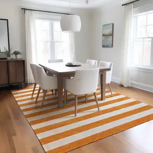 Photo of 3' X 5' Orange and White Striped Washable Non Skid Indoor Outdoor Area Rug