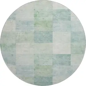 Photo of 8' X 8' Pale Aqua Mint Green And Ivory Geometric Washable Round Rug With UV Protection