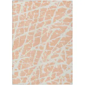 Photo of 3' X 4' Peach and Ivory Abstract Washable Non Skid Indoor Outdoor Area Rug