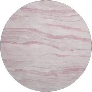 Photo of 8' X 8' Pink And Ivory Striped Washable Round Rug With UV Protection