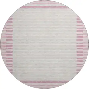 Photo of 8' X 8' Pink Ivory And Mauve Striped Washable Round Rug With UV Protection